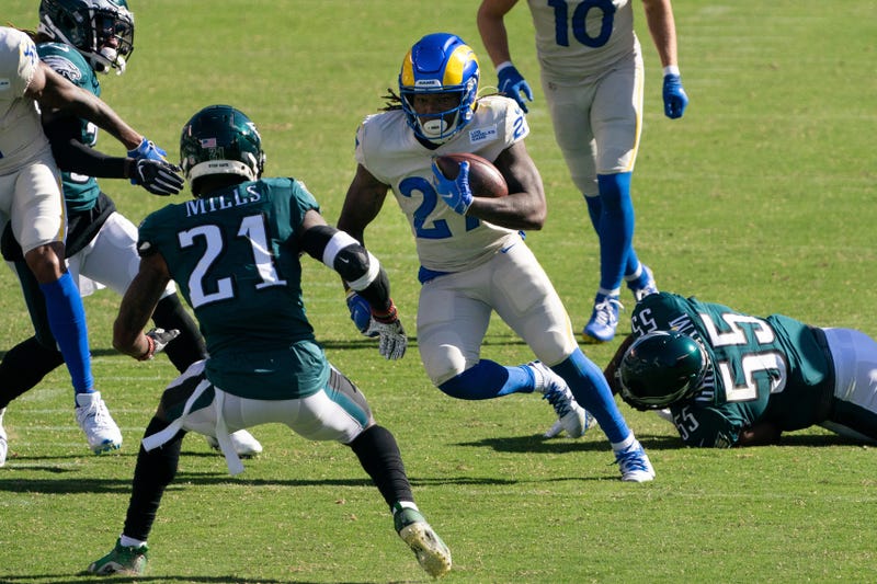 Los Angeles Rams running back Darrell Henderson (27) runs with the ball after breaking the tackle attempt of Philadelphia Eagles defensive end Brandon Graham (55) during the fourth quarter at Lincoln Financial Field.