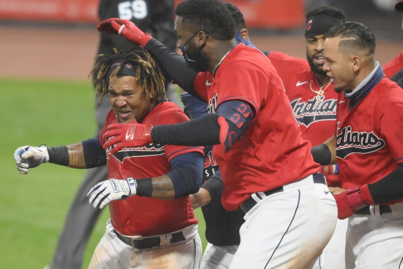 Cleveland Indians third baseman Jose Ramirez (11), left, celebrates his game-winning, three-run home run in the tenth inning against the Chicago White Sox at Progressive Field.