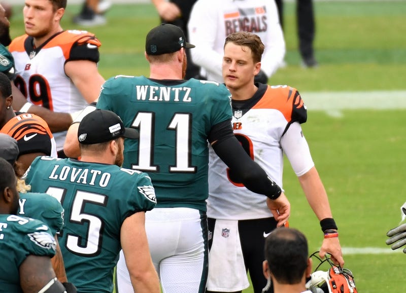 Philadelphia Eagles quarterback Carson Wentz (11) and Cincinnati Bengals quarterback Joe Burrow (9) meet on the field after the game at Lincoln Financial Field.