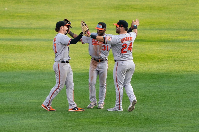 O's outfielders DJ Stewart, Cedric Mullins, and Austin Hays in the outfield.