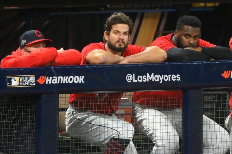 Cleveland Indians relief pitcher Brad Hand (33), center, watches from the dugout after blowing a save in the ninth inning against the New York Yankees at Progressive Field.