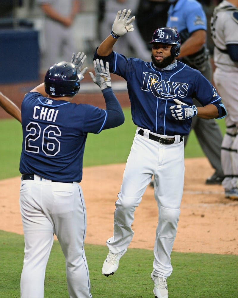 Tampa Bay Rays right fielder Manuel Margot (13) celebrates with first baseman Ji-Man Choi (26) after hitting a two-run homerun in the 3rd inning against the New York Yankees during game two of the 2020 ALDS at Petco Park.