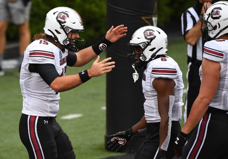 South Carolina Gamecocks quarterback Collin Hill (15) celebrates after a touchdown with South Carolina Gamecocks wide receiver Josh Vann (6) during the second half at Vanderbilt Stadium.