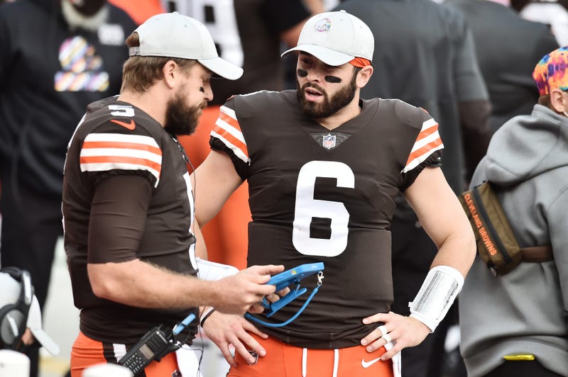 Cleveland Browns quarterback Baker Mayfield (6) talks with quarterback Case Keenum (5) during the first half against the Indianapolis Colts at FirstEnergy Stadium.