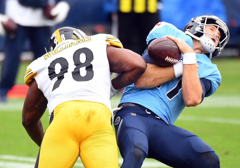 quarterback Ryan Tannehill (17) is hit by Pittsburgh Steelers inside linebacker Vince Williams (98)