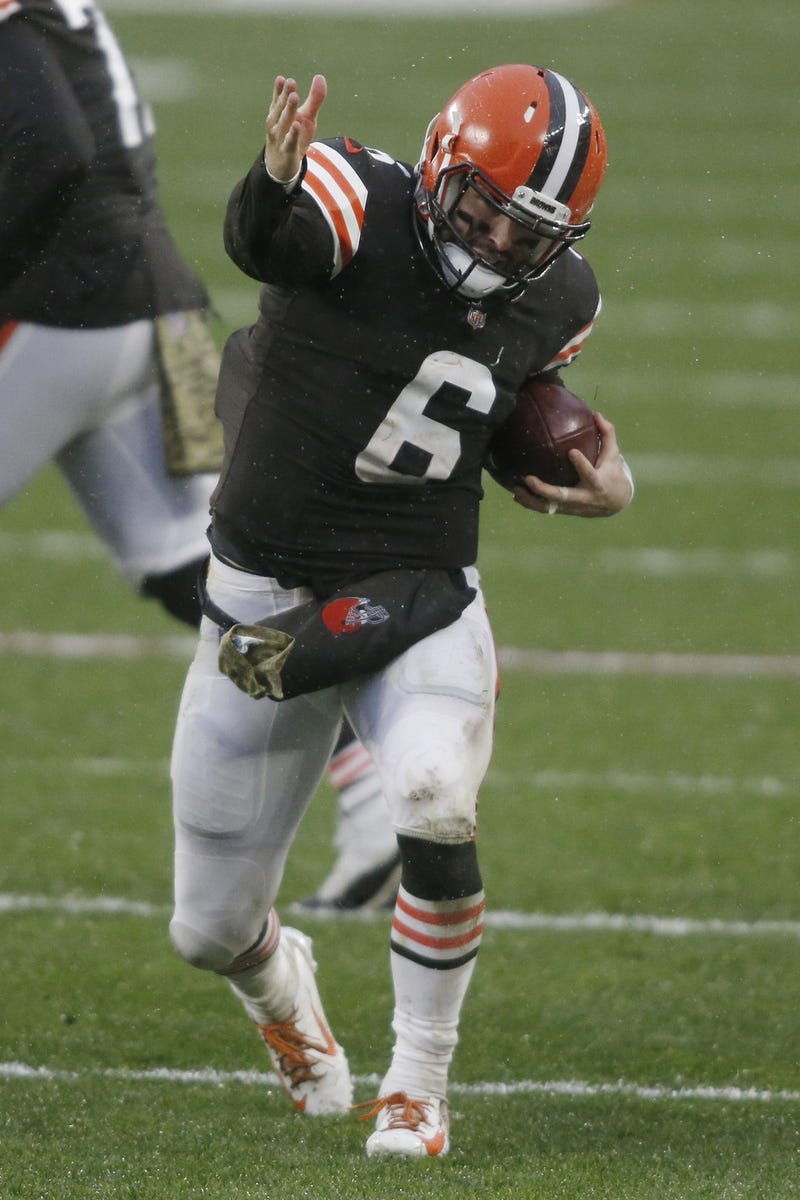 Cleveland Browns quarterback Baker Mayfield (6) motions for a first down after a run during the second half against the Philadelphia Eagles at FirstEnergy Stadium.