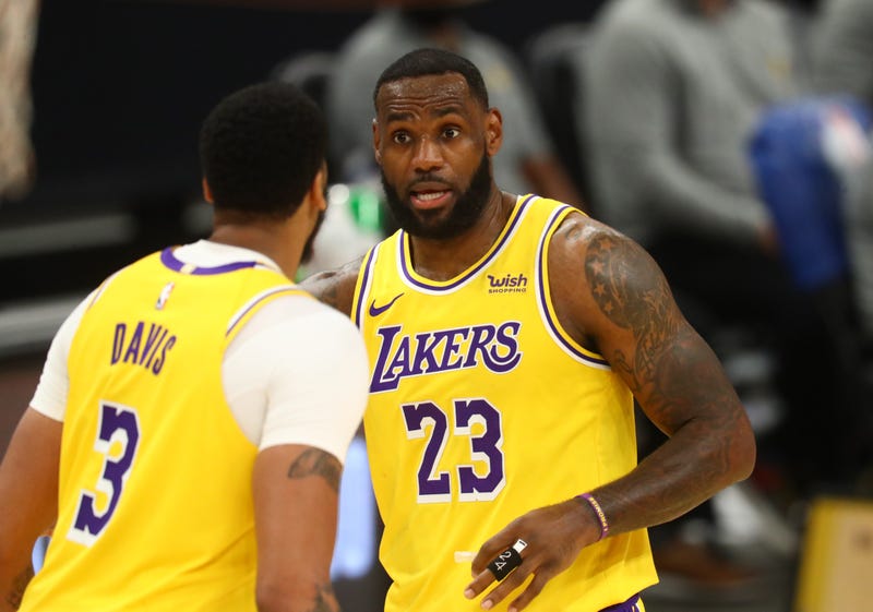 Lakers stars LeBron James and Anthony Davis on the court.