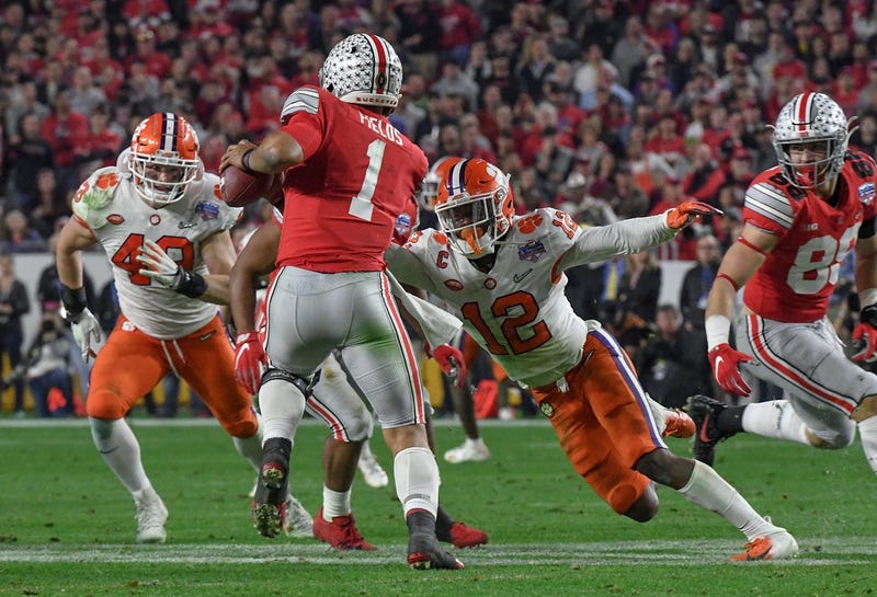 Clemson defensive back K'Von Wallace (12) sacks Ohio State quarterback Justin Fields(1) near linebacker Chad Smith (43) during the third quarter of the PlayStation Fiesta Bowl of the College Football Playoffs semi-final game, at State Farm Stadium in Glendale, Arizona Saturday, December 28, 2019. Clemson Vs Ohio State Fiesta Bowl