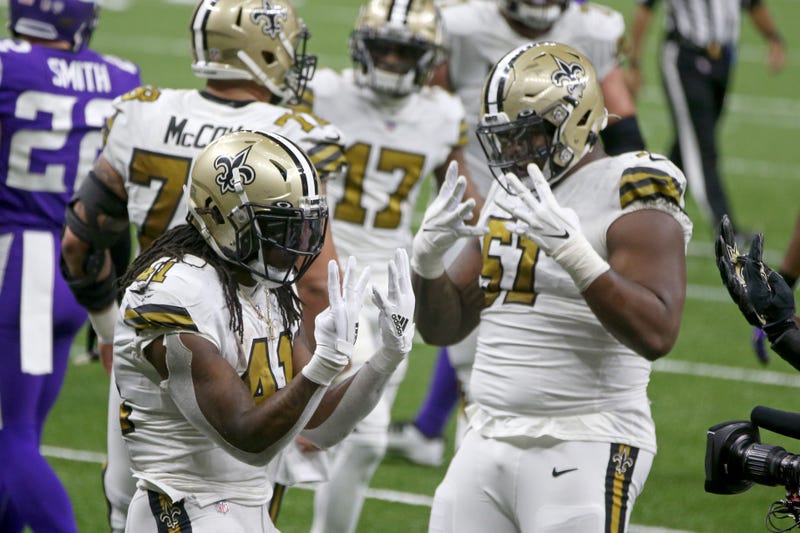 Alvin Kamara and Cesar Ruiz of the New Orleans Saints