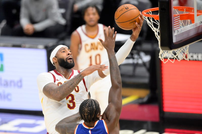 Dec 29, 2020; Cleveland, Ohio, USA; Cleveland Cavaliers center Andre Drummond (3) drives against New York Knicks forward Julius Randle (30) in the third quarter at Rocket Mortgage FieldHouse.