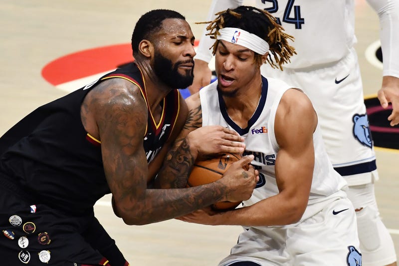 Cleveland Cavaliers center Andre Drummond (L) and Memphis Grizzlies forward Brandon Clarke (R) fight for possession during the fourth quarter at Rocket Mortgage FieldHouse.