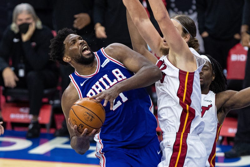 Philadelphia 76ers center Joel Embiid (21) is fouled by Miami Heat forward Kelly Olynyk (9) in overtime at Wells Fargo Center.