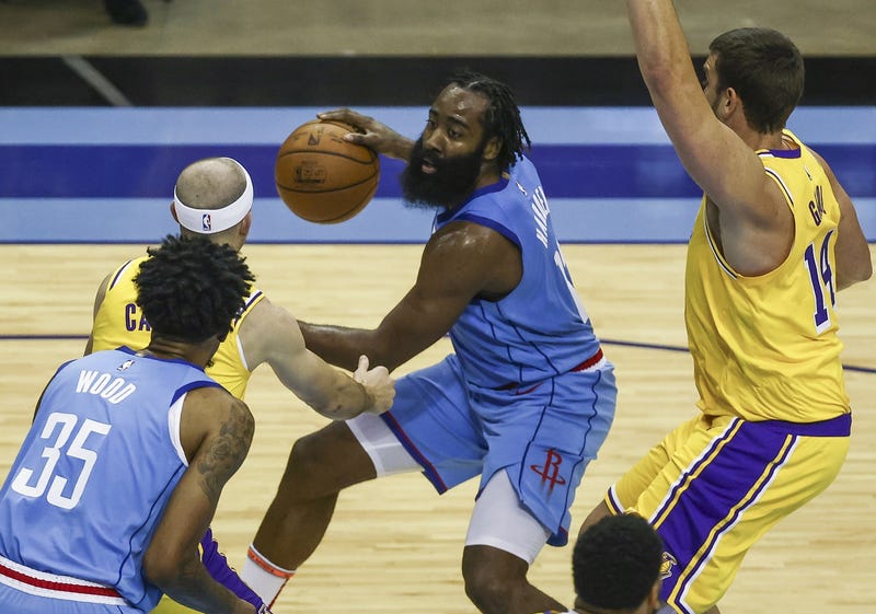 Houston Rockets guard James Harden (middle) dribbles the ball against the Los Angeles Lakers during the third quarter at Toyota Center.