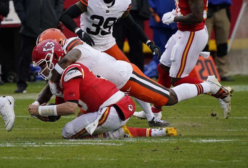 Kansas City Chiefs quarterback Patrick Mahomes (15) is brought down by Cleveland Browns outside linebacker Mack Wilson (51) during the second half in the AFC Divisional Round playoff game at Arrowhead Stadium. Mahomes would suffer an injury on the play.