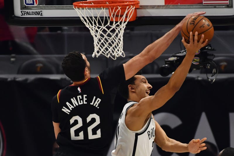 Jan 22, 2021; Cleveland, Ohio, USA; Cleveland Cavaliers forward Larry Nance Jr. (22) blocks the shot of Brooklyn Nets guard Landry Shamet (20) during the first quarter at Rocket Mortgage FieldHouse.