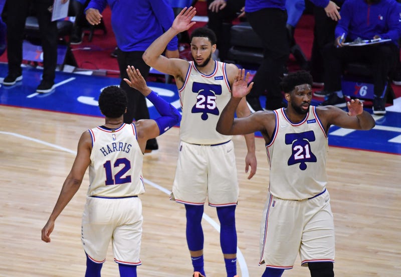 Philadelphia 76ers stars Joel Embiid, Ben Simmons, and Tobias Harris on the court.