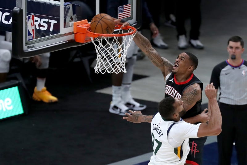 Houston Rockets forward DaQuan Jeffries (right) dunks against Utah Jazz center Rudy Gobert (27) in the fourth quarter at Vivint Arena.