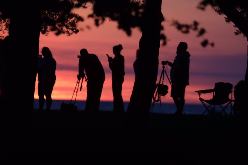 A crowd gathers at Hamlin Beach State Park in New York to watch the solar eclipse on Thursday morning