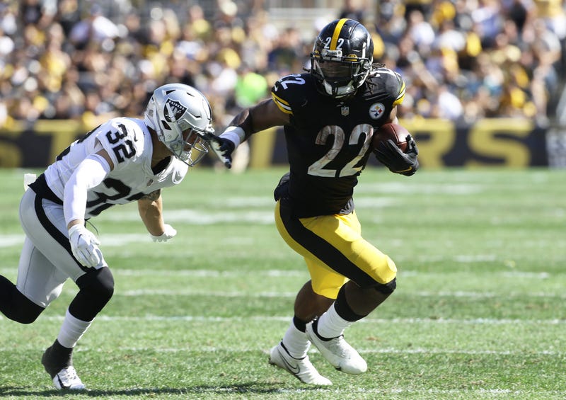 Najee Harris runs against the Raiders