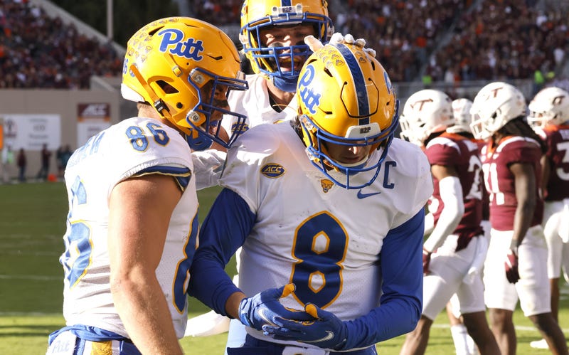 Blacksburg, Virginia, USA; Pittsburgh Panthers quarterback Kenny Pickett (8) celebrates a touchdown