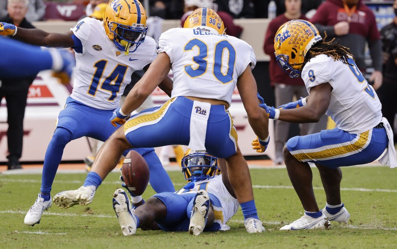 Pitt celebrating interception by Erick Hallett