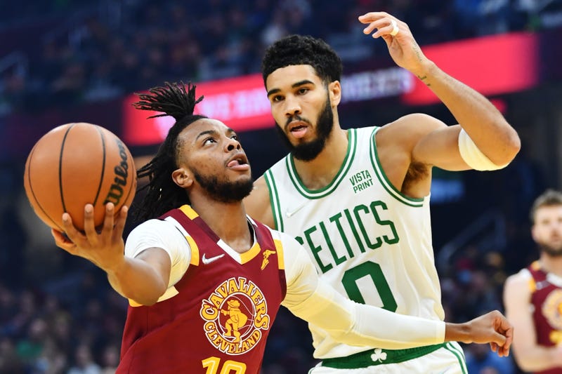 Nov 13, 2021; Cleveland, Ohio, USA; Cleveland Cavaliers guard Darius Garland (10) drives to the basket against Boston Celtics forward Jayson Tatum (0) during the first quarter at Rocket Mortgage FieldHouse.