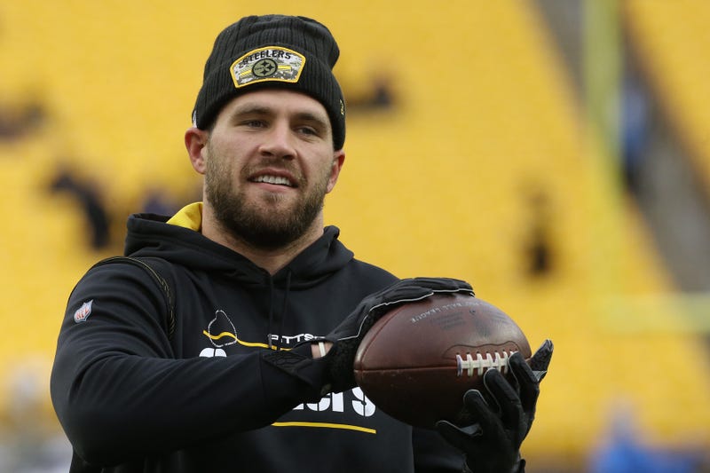 TJ Watt before a game catching a ball