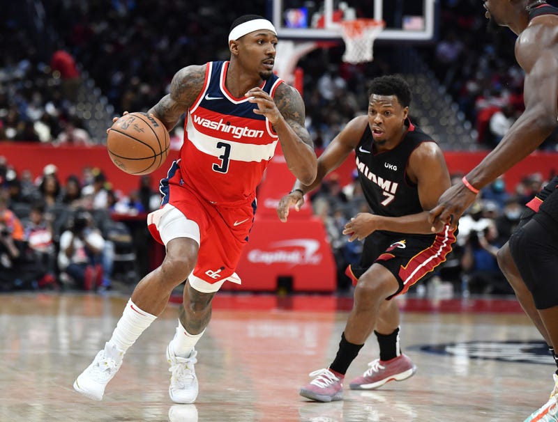 Bradley Beal dribbles against Kyle Lowry