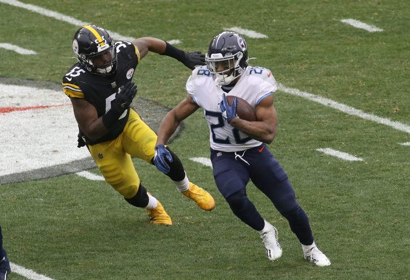 Tennessee Titans running back Jeremy McNichols (28) runs the ball against Pittsburgh Steelers inside linebacker Devin Bush (55