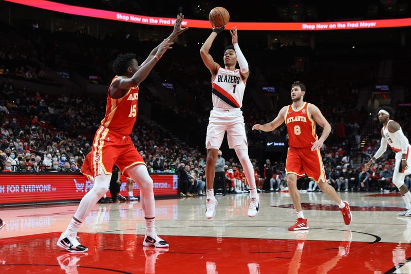 Portland Trail Blazers guard Anfernee Simons (1) shoots over Atlanta Hawks center Clint Capela (15) in the first half at Moda Center.