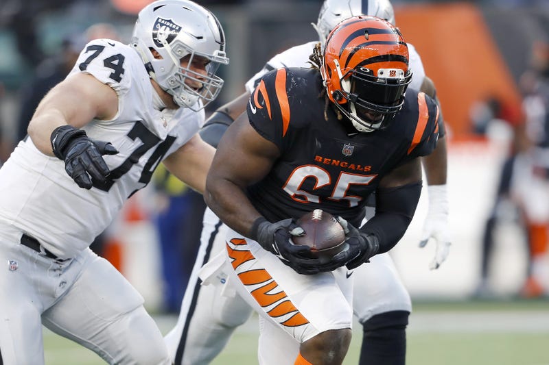 Cincinnati Bengals defensive tackle Larry Ogunjobi (65) picks up the fumble as Las Vegas Raiders offensive tackle Kolton Miller (74) goes for the tackle