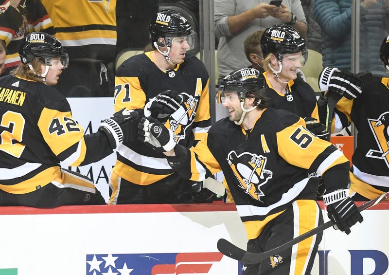 Pittsburgh Penguins defenseman Kris Letang (58) celebrates a goal with his teammates as they play the Arizona Coyotes during the third period at PPG Paints Arena. The Penguins won 6-3.