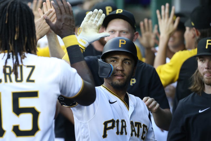 Pirates catcher Michael Perez (5) celebrates his solo home run in the dugout against the Chicago Cubs
