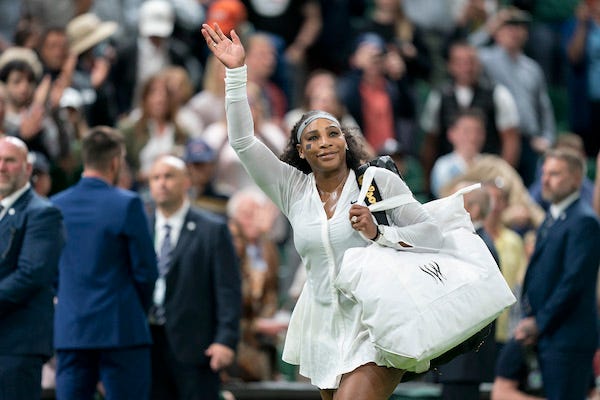Serena Williams leaves the court and waves to the crowd