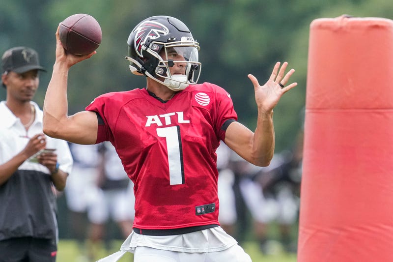 Aug 1, 2022; Flowery Branch, GA, USA; Atlanta Falcons quarterback Marcus Mariota (1) passes during training camp at IBM Performance Field.