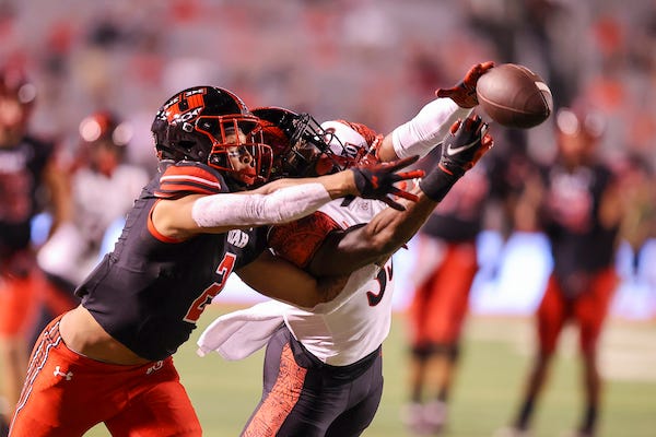 Utah Utes running back Micah Bernard and San Diego State Aztecs safety Patrick McMorris