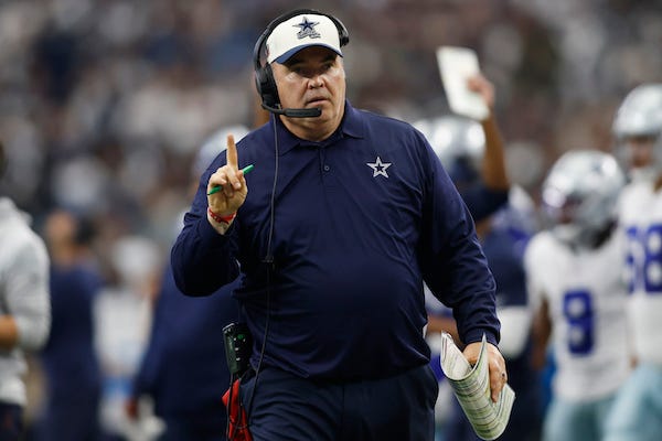 Dallas Cowboys head coach Mike McCarthy signals that the ball is on the one yard line in the third quarter against the Detroit Lions at AT&T Stadium