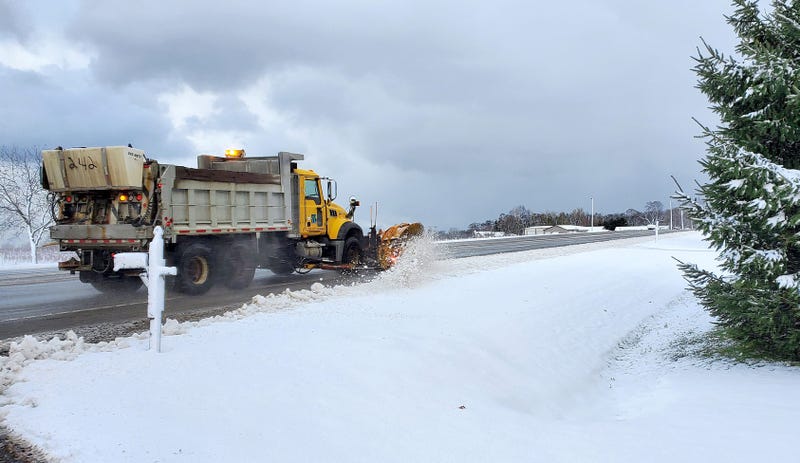 A PennDOT plow truck clears snow, on Nov. 17, 2022, from the shoulder of the road in the 11000 block of Route 20 in North East Township.