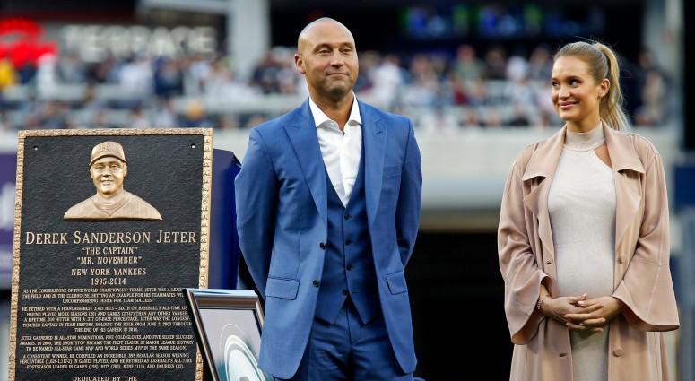 Former New York Yankees shortstop Derek Jeter and his wife Hannah look on during a ceremony to retire his jersey number and unveil his monument to be placed in monument park before the game against the Houston Astros on May 14, 2017 at Yankee Stadium.
