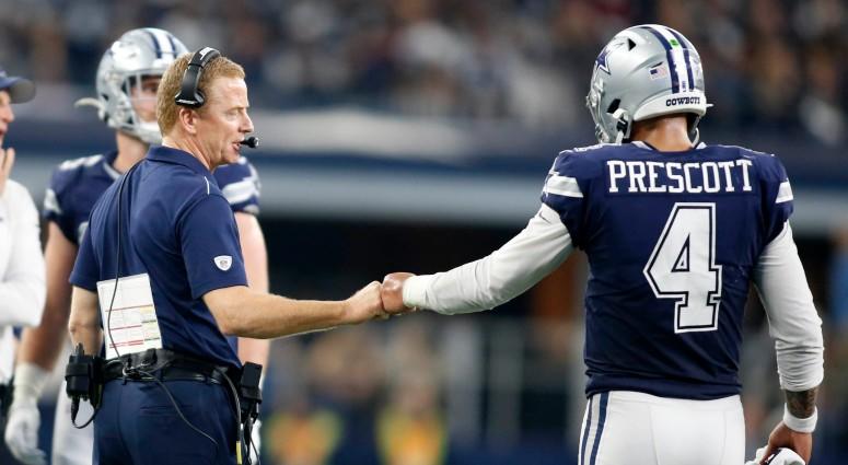 Dallas Cowboys head coach Jason Garrett congratulates quarterback Dak Prescott (4) during a time out in the game against the Los Angeles Rams on Dec 15, 2019 at AT&T Stadium.
