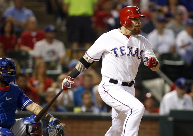 Oct 11, 2015; Arlington, TX, USA; Texas Rangers left fielder Josh Hamilton hits a single against the Toronto Blue Jays in the fifth inning in game three of the ALDS at Globe Life Park in Arlington