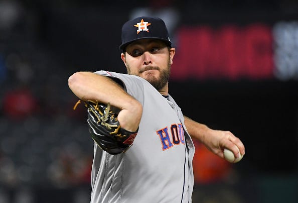 Wade Miley tosses a pitch in the second inning for the Astros.