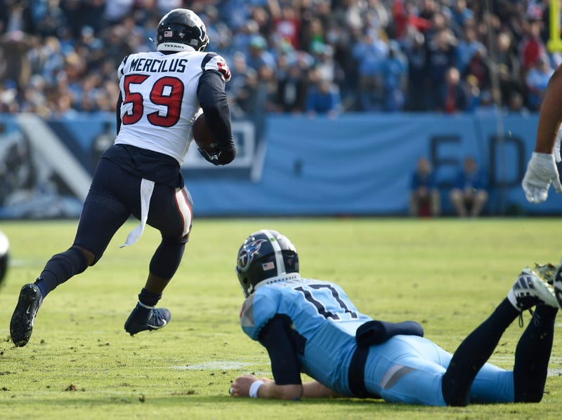 Tennessee Titans quarterback Ryan Tannehill (17) can only watch as Houston Texans outside linebacker Whitney Mercilus (59) runs an interception back for a touchdown during the second quarter at Nissan Stadium in Nashville, Tenn., Sunday, Dec. 15, 2019. Gw48128