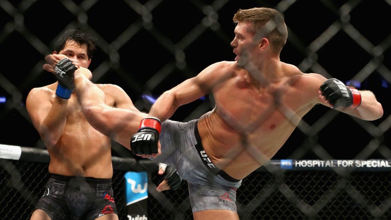 Stephen Thompson lands a kick to the face of Jorge Masvidal during a UFC fight in 2017.