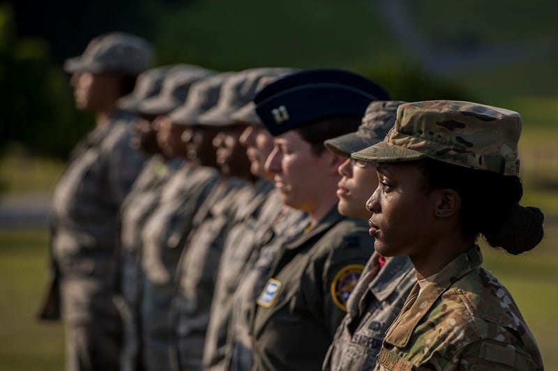 Airmen stand at attention during a retreat ceremony March 30, 2018, on Kadena Air Base, Japan. An all-female formation was coordinated in honor of Women’s History Month, which brings attention to the accomplishments and achievements of women throughout history.