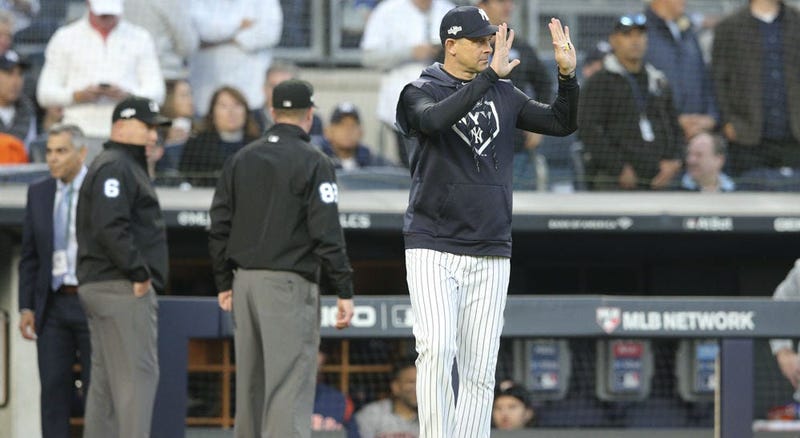 Yankees manager Aaron Boone argues with home plate umpire Ben May on Aug. 17, 2019, against the Cleveland Indians at Yankee Stadium.