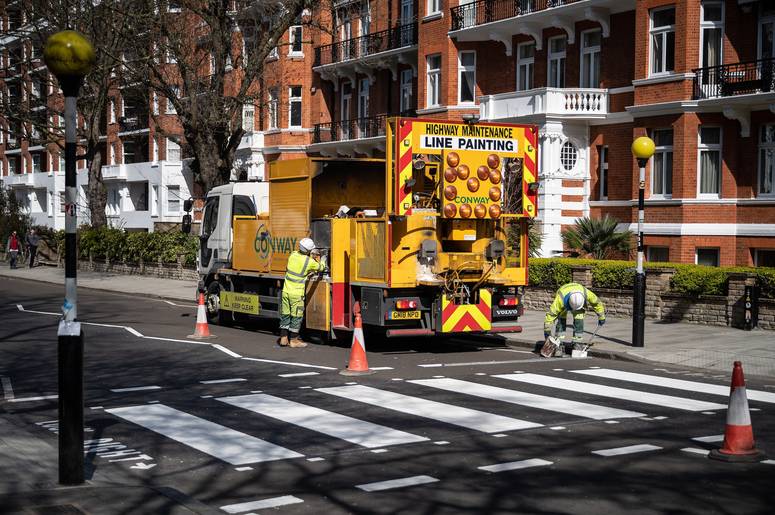 Highway Maintenance team re-paint the iconic Abbey Road crossing on March 24, 2020 in London, England.