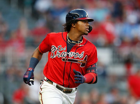 Ronald Acuna runs to first base.