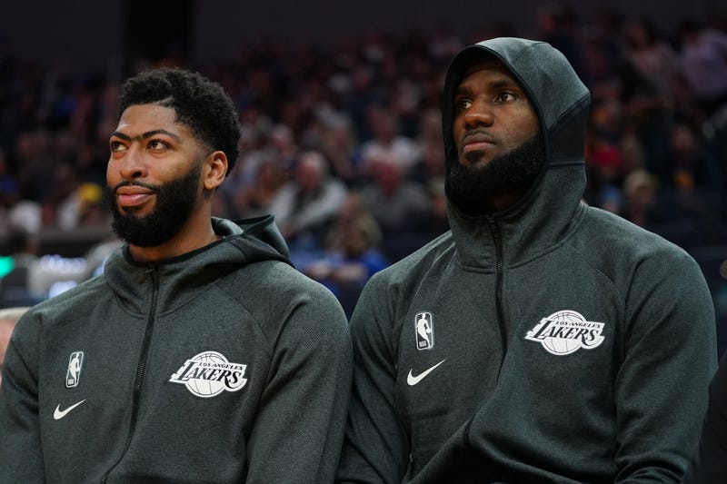 Anthony Davis and LeBron James prepare for a preseason game with Lakers.