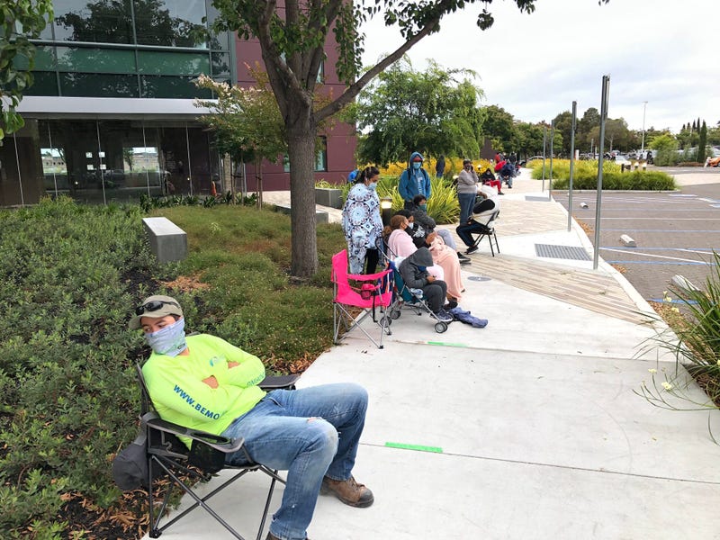 Long line forms for free rapid coronavirus tests in Alameda